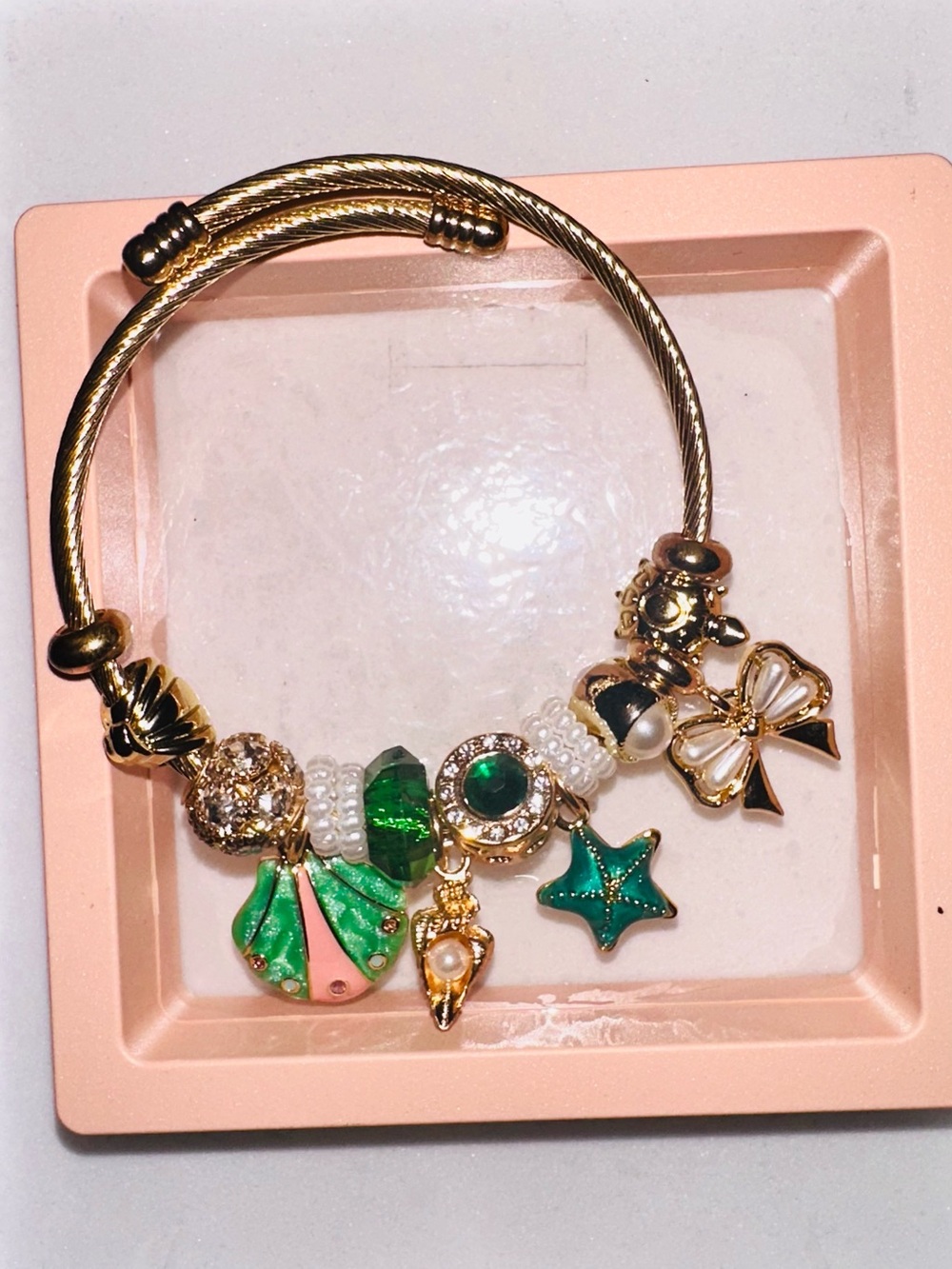 Gold-Tone Green Charm Bracelet with Pearls and Enamel Bow